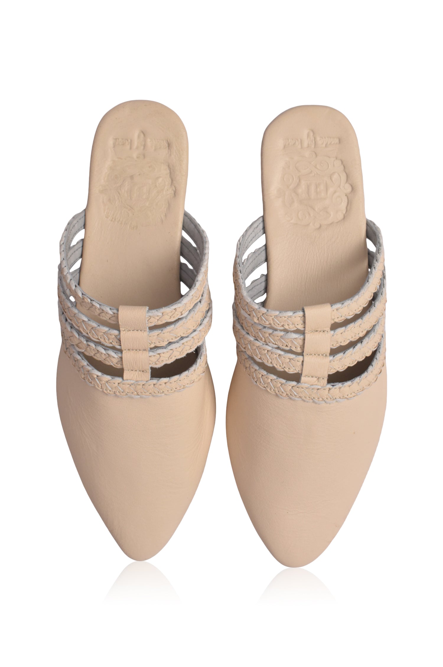Audrea cream color leather pointed-toe mules with woven straps on a white background