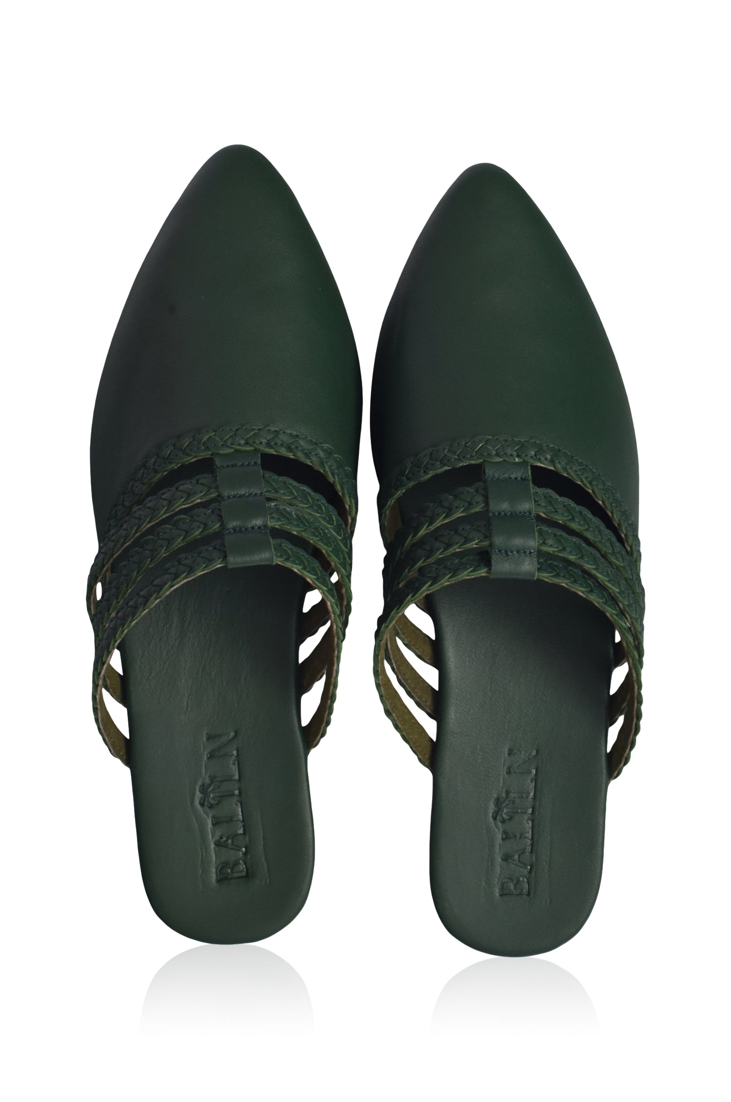 Pair of Audrea emerald green leather pointed-toe shoes on a white background
