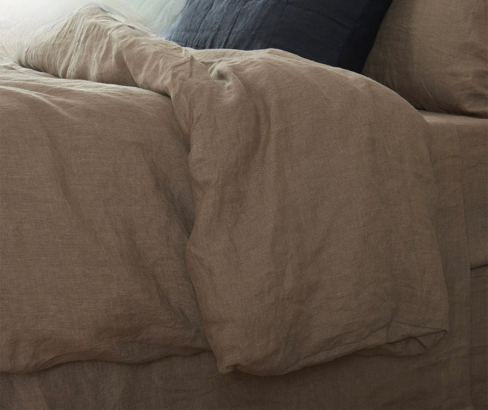 Closeup of linen cotton duvet set  on a bed with pillows