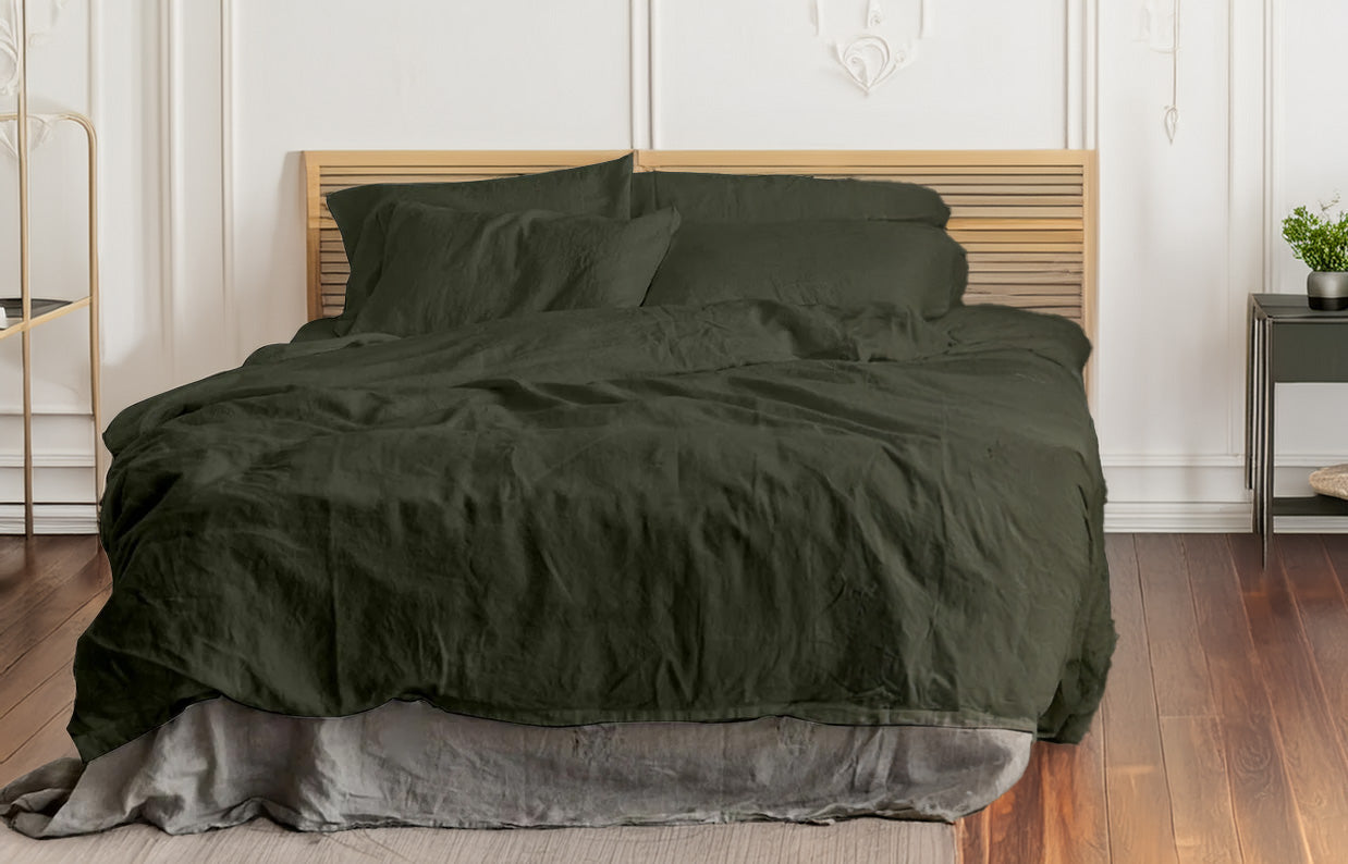 Moss green linen and cotton duvet set on a bed in a bedroom setting